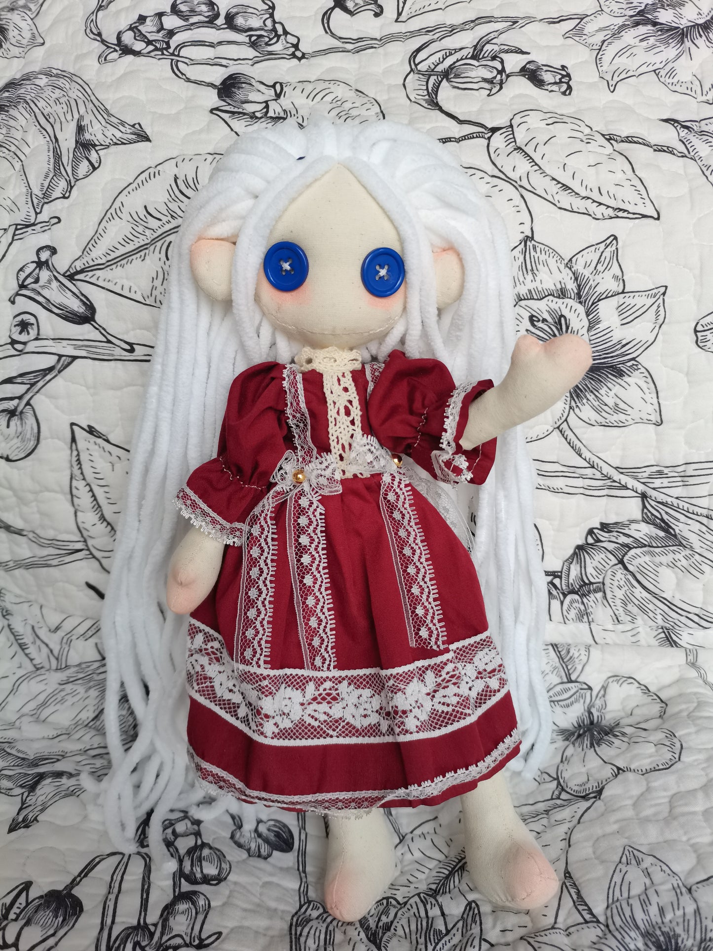 handmade doll with a red dress